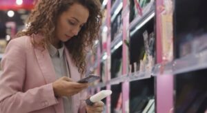 pink jacket customer scanning qr code